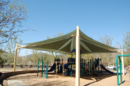 Fabric tensioned shade structure